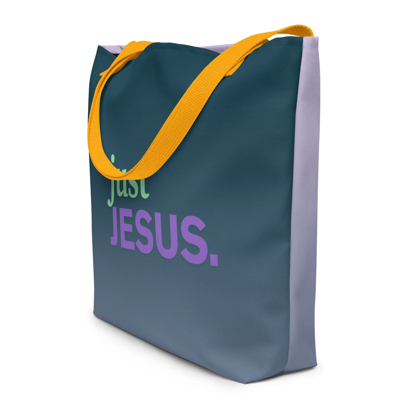 Angled view of dark teal tote bag with yellow straps and “just JESUS.” text in green and purple.