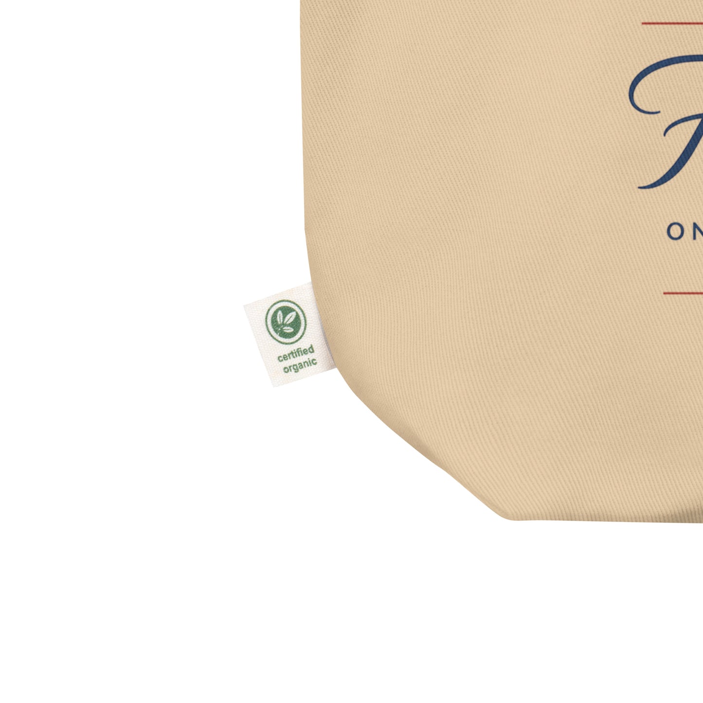 Close-up of a natural cotton Christian patriotic tote bag showing the beige fabric texture, certified organic side tag, and part of the “250 Years of Freedom” design.
