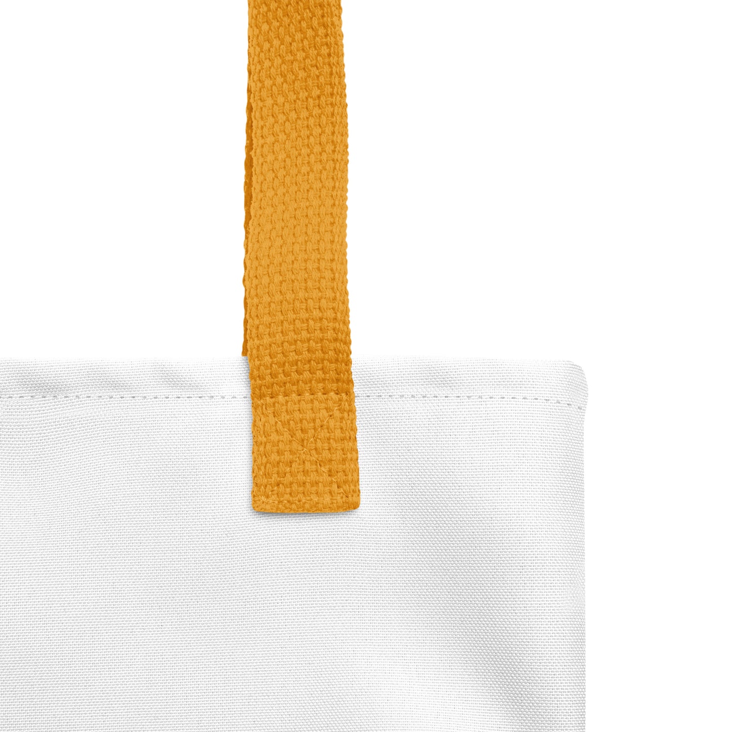 Close-up of the white tote fabric and yellow strap, highlighting the stitching, textured canvas, and strap weave detail.