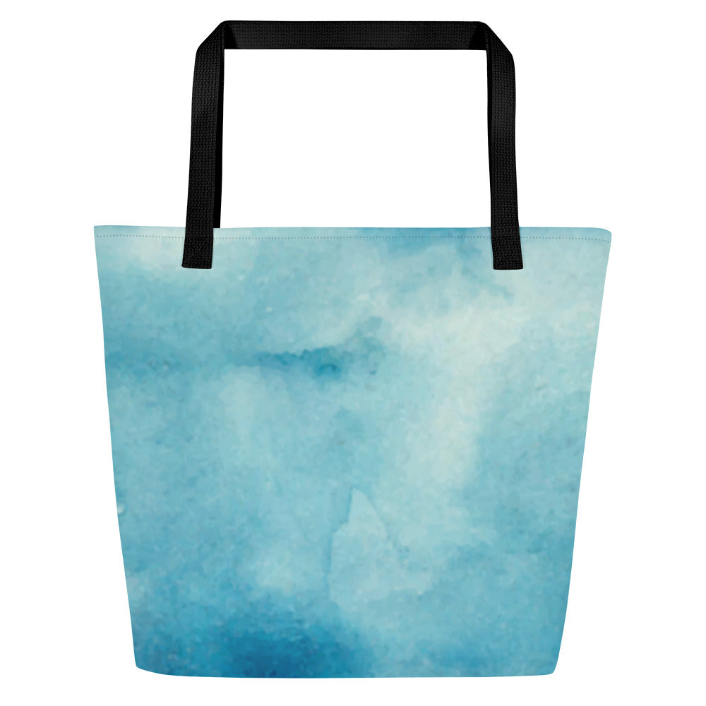 Back view of light blue watercolor tote bag with black straps and a solid watercolor design with no text.