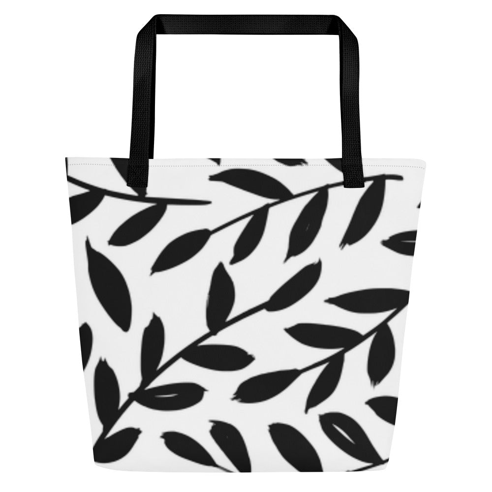 Back view of black-and-white tote bag with black straps and allover leaf pattern, without the “Made New” text box.