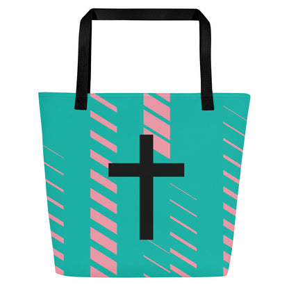 Front view of teal tote bag with black straps, pink diagonal stripe accents, and a large black cross on the front.