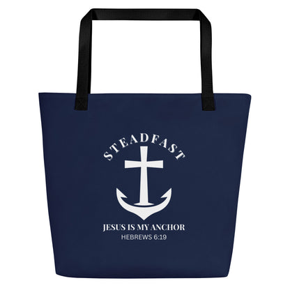 Front view of navy blue tote bag with black straps and a white anchor-and-cross graphic reading “STEADFAST,” “Jesus is my anchor,” and “Hebrews 6:19.”