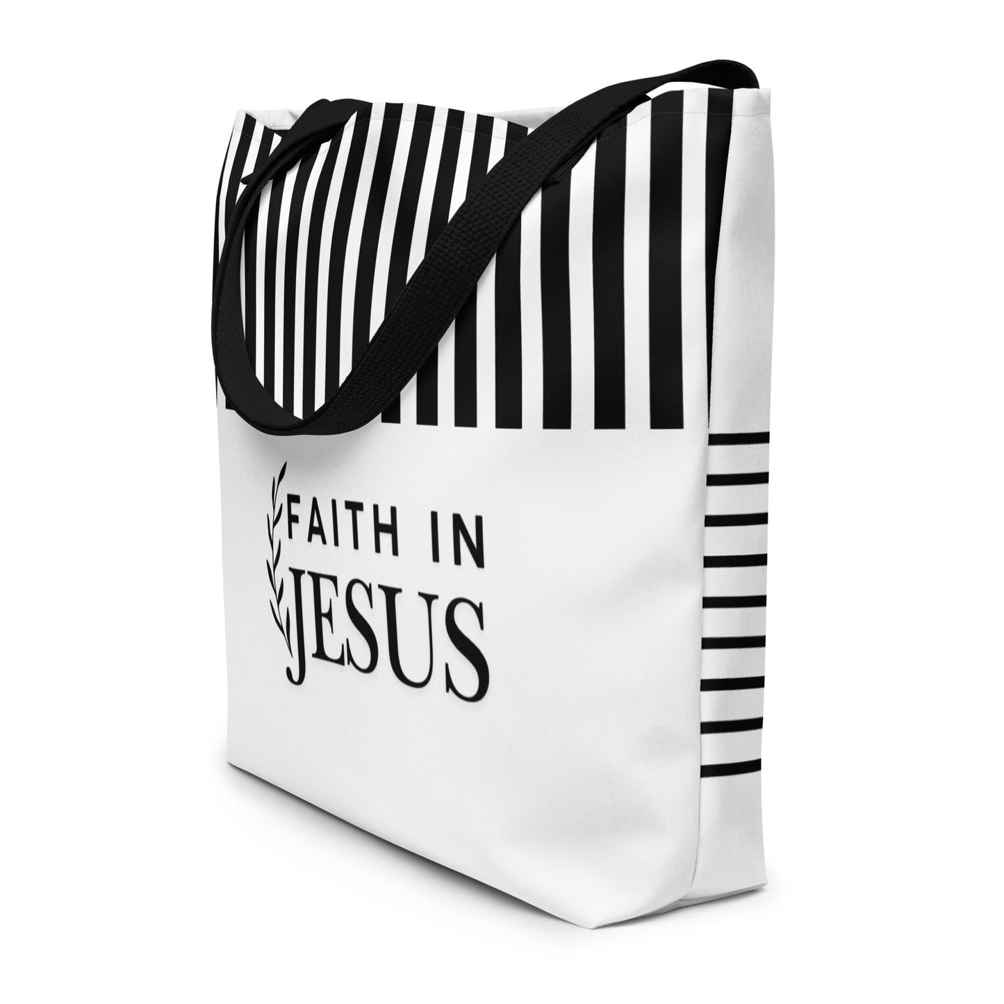 Angled view of white tote bag with black straps, black stripe accents, and “FAITH IN JESUS” text on the front.