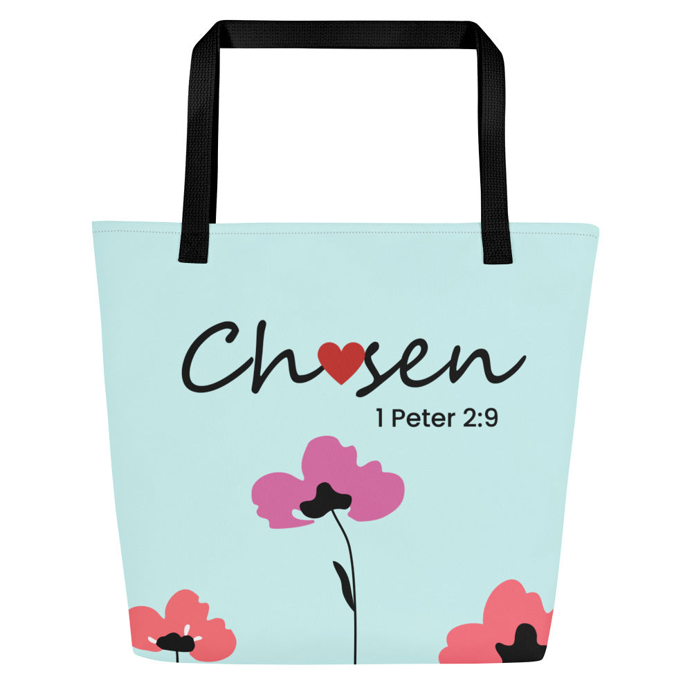 Front view of a large tote bag with black webbing straps and a pale aqua/mint background. The word “Chosen” appears in black script with a red heart used as the “o,” and “1 Peter 2:9” printed beneath in smaller black text. Simple floral illustrations decorate the bottom corners, including pink and coral-red flowers and a taller pink flower with a thin black stem in the center.