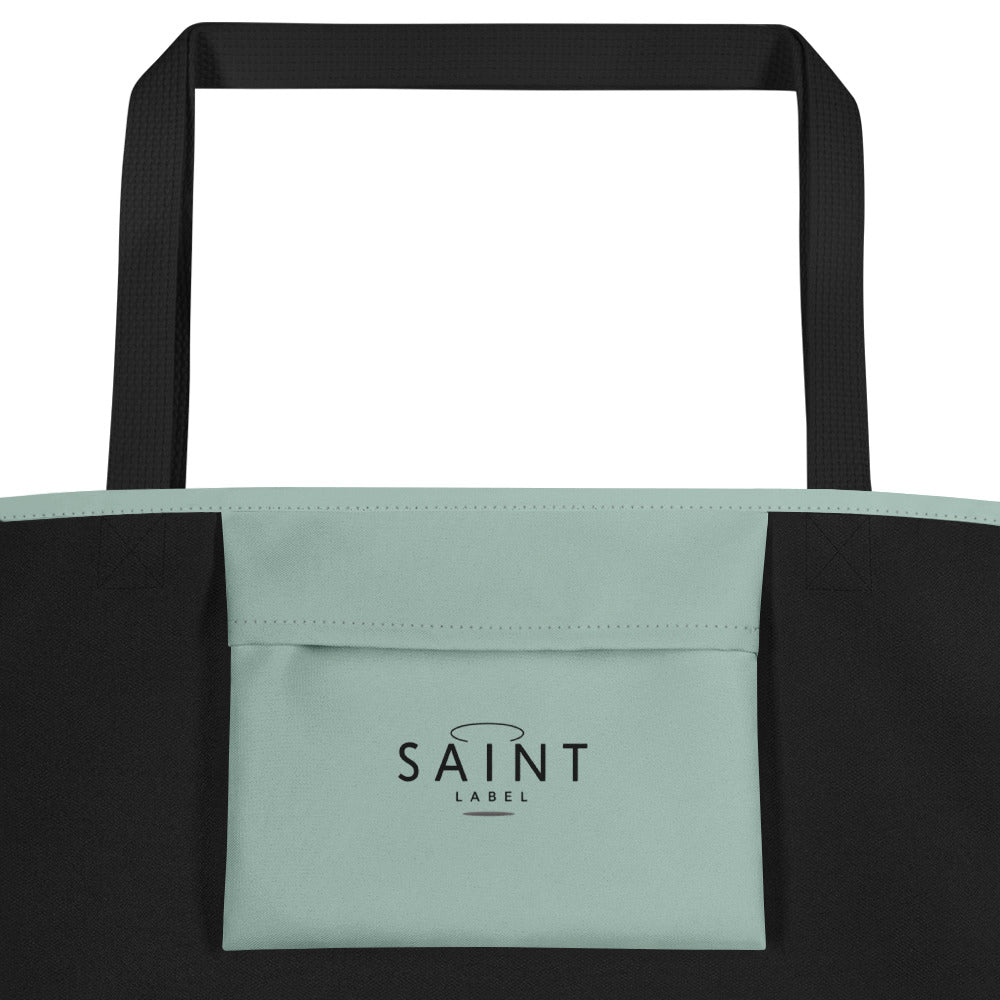 Inside pocket view showing a sage green interior pocket with “Saint Label” branding.