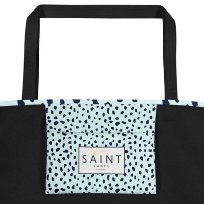 Inside pocket view showing a light blue interior pocket with “Saint Label” branding.
