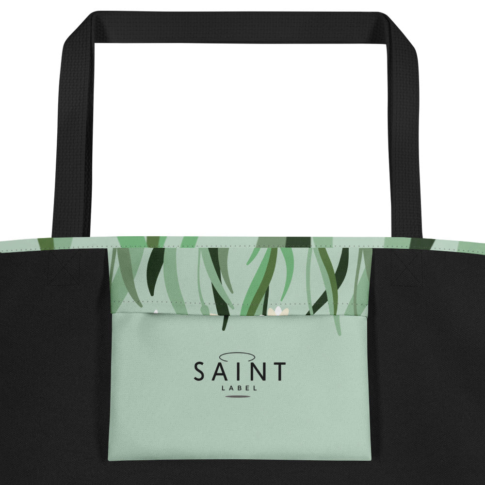 Inside pocket view showing a sage green interior pocket with “Saint Label” branding.
