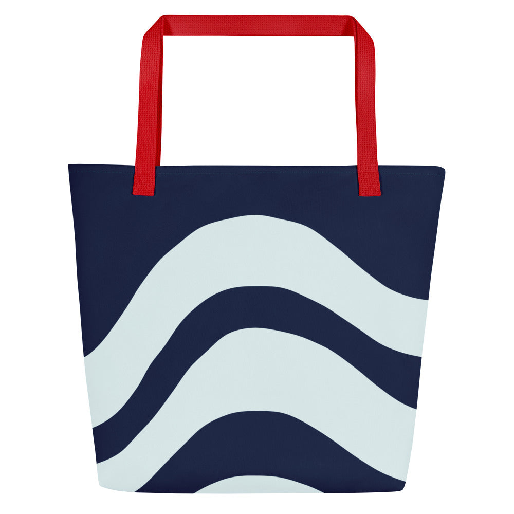 Back view of tote bag with red straps, dark navy body, and large white wave stripes across the lower half.