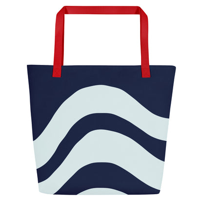 Back view of tote bag with red straps, dark navy body, and large white wave stripes across the lower half.