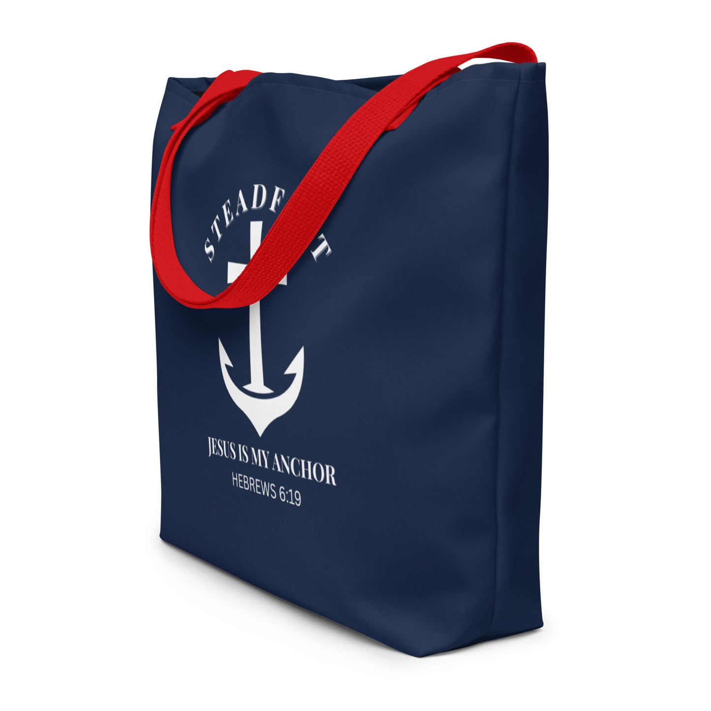 Angled view of navy tote bag with red straps and white “Steadfast” anchor-and-cross graphic with Hebrews 6:19.