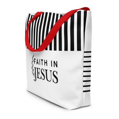 Angled view of white tote bag with red straps, black stripe accents, and “FAITH IN JESUS” text on the front.