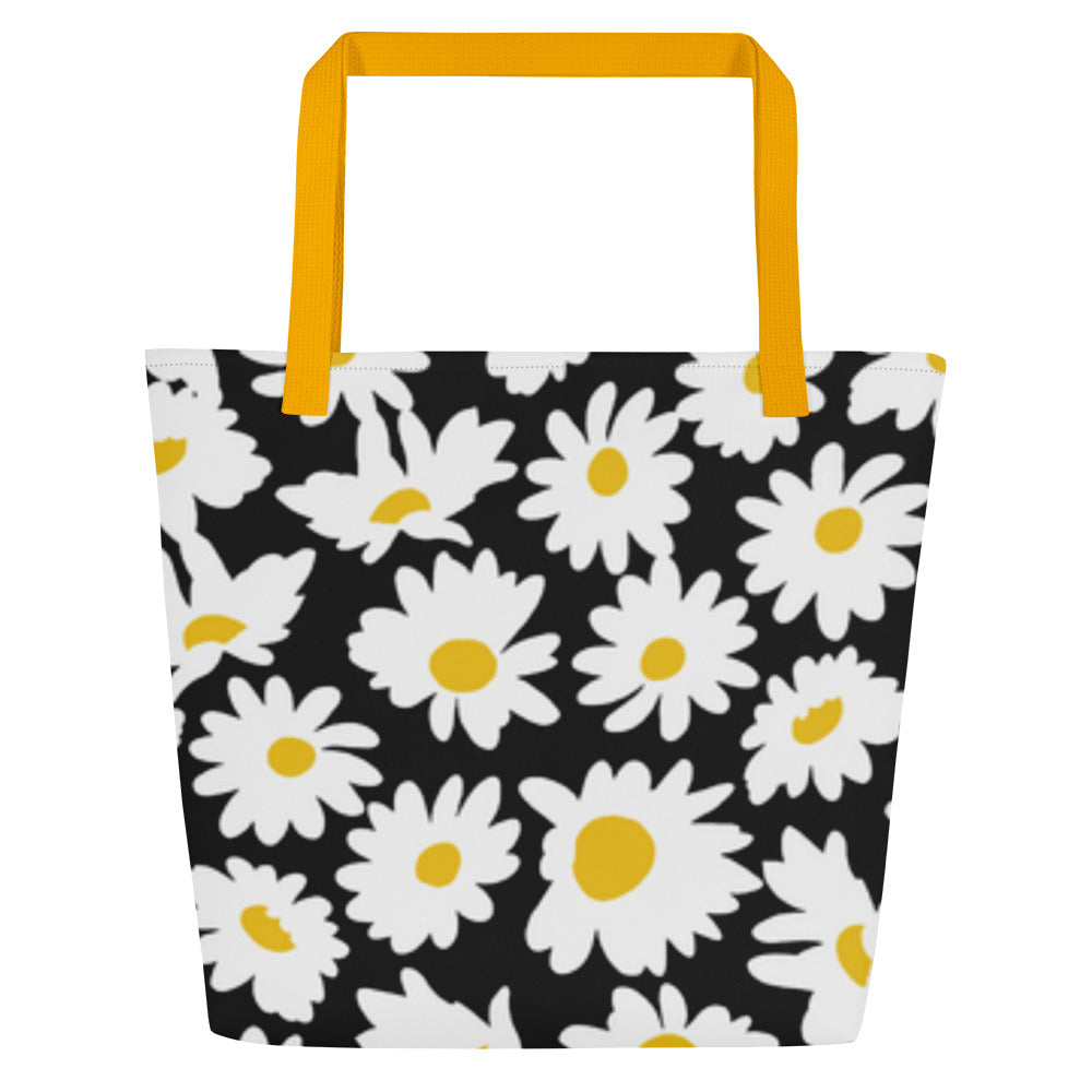 Back view of black tote bag with mustard yellow straps and allover white daisy pattern, without the “JESUS” crown graphic.