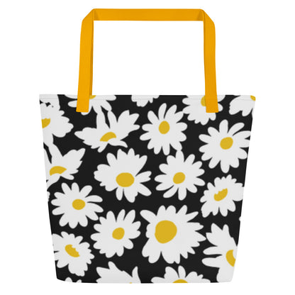 Back view of black tote bag with mustard yellow straps and allover white daisy pattern, without the “JESUS” crown graphic.