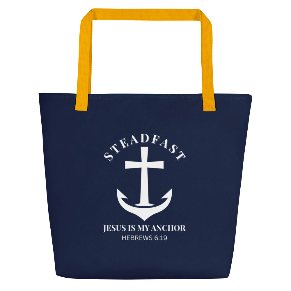 Front view of navy blue tote bag with yellow straps and a white anchor-and-cross graphic reading “STEADFAST,” “Jesus is my anchor,” and “Hebrews 6:19.”