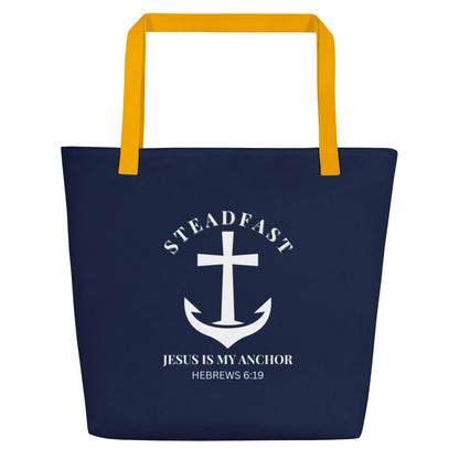 Front view of navy blue tote bag with yellow straps and a white anchor-and-cross graphic reading “STEADFAST,” “Jesus is my anchor,” and “Hebrews 6:19.”