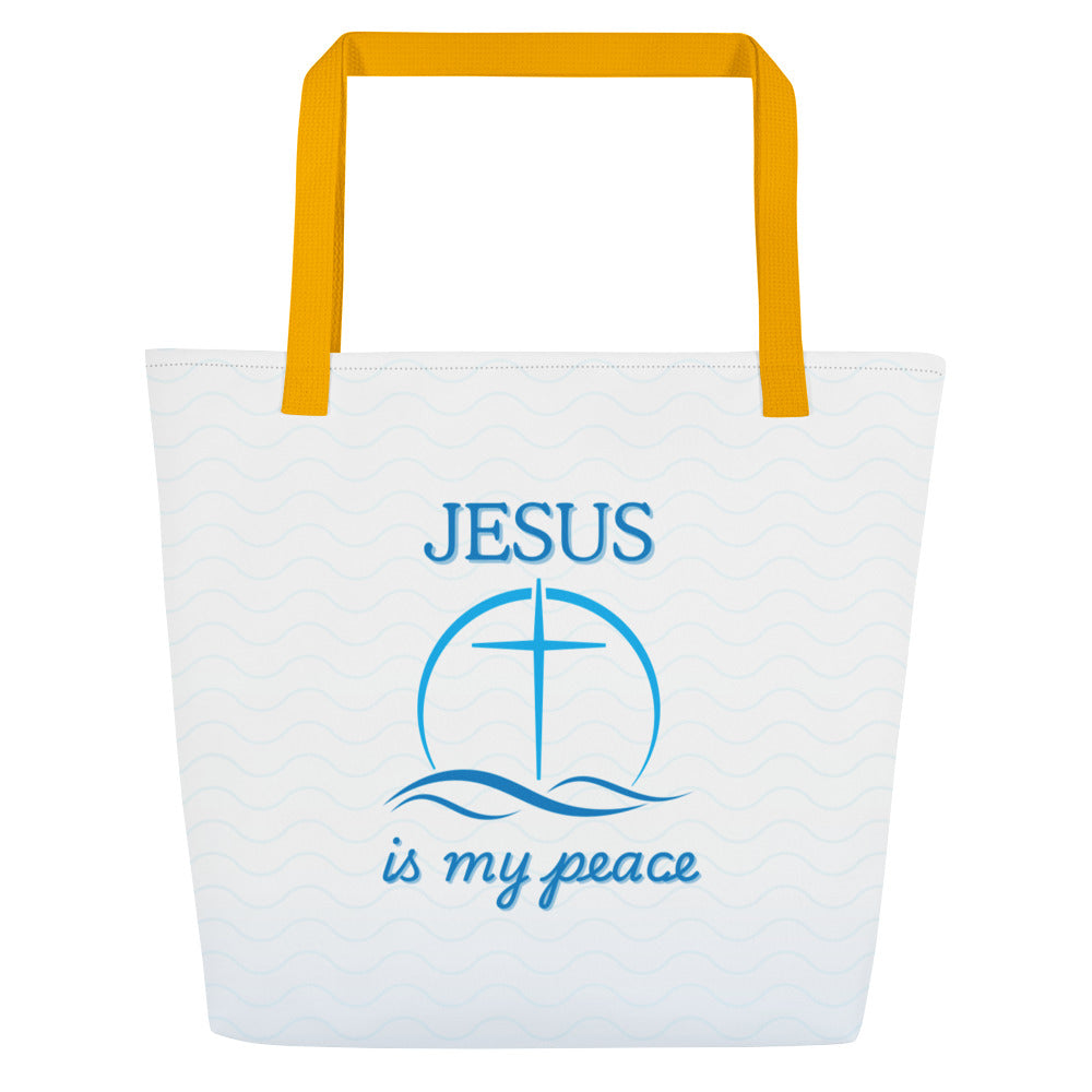 Front view of a large tote bag with golden-yellow straps and a white body patterned with faint light-blue waves. Centered blue artwork shows the word “JESUS” above a cross inside a circle, with wave lines below and the phrase “is my peace” in blue script.