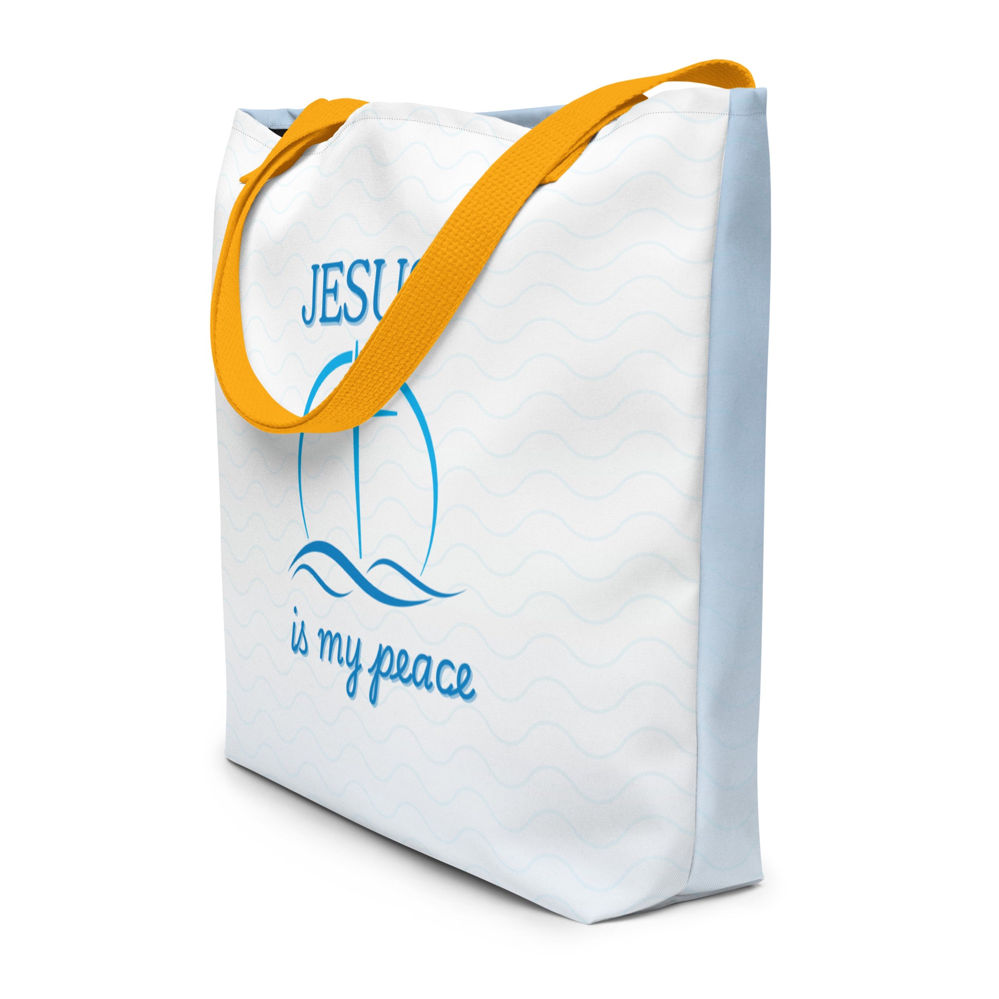 Angled view of the tote showing the white wave-pattern front with the blue “JESUS is my peace” cross-and-waves graphic, plus the light-blue back panel; golden-yellow straps.