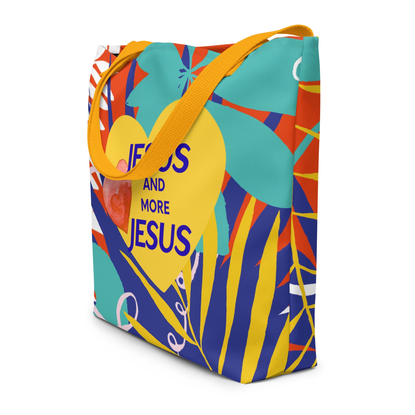 Angled view of the tote showing the colorful pattern wrapping around the sides and the centered yellow heart graphic with the “JESUS AND MORE JESUS” text; mustard-yellow straps drape over the top.