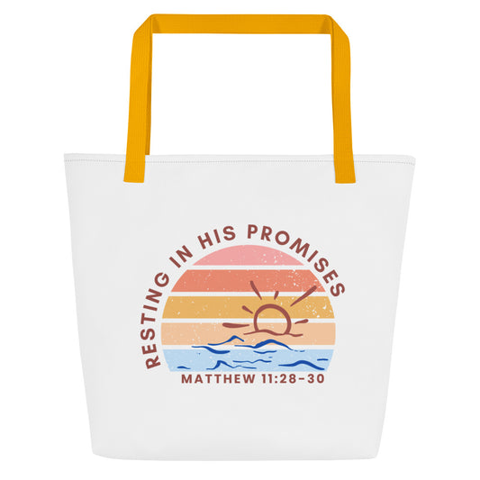 White tote bag with mustard-yellow straps featuring a retro sunset graphic over blue waves; text arcs above the graphic reading “RESTING IN HIS PROMISES,” with “MATTHEW 11:28–30” printed beneath.