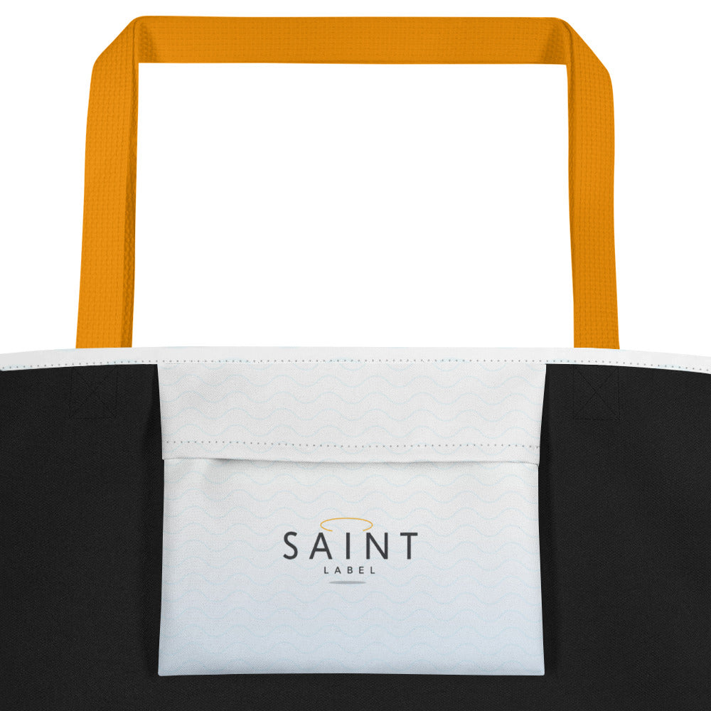 Tote bag with mustard yellow handles and 'SAINT LABEL' logo on a white fabric with subtle wave pattern.