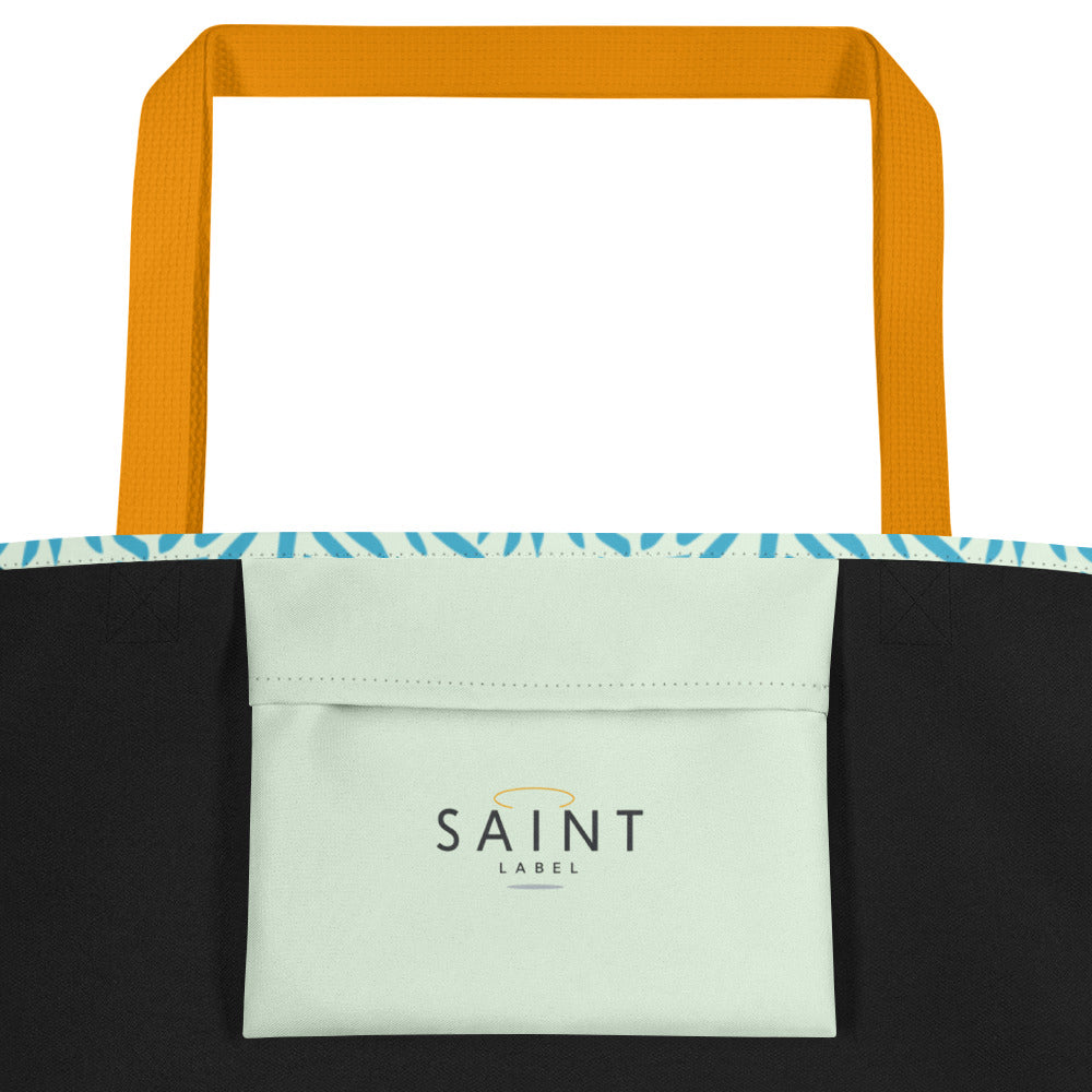 Inside pocket view showing a light mint interior pocket with “Saint Label” branding.