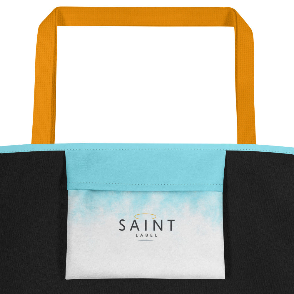 Inside pocket view showing black side panels and a light blue pocket panel that fades into white near the bottom. A centered white label on the pocket reads “Saint Label."