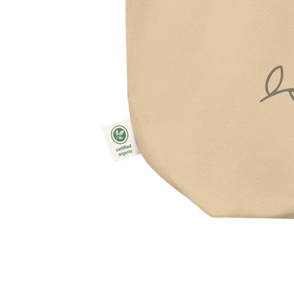 Close-up of a natural cotton Christian tote bag showing the beige fabric texture, certified organic side tag, and part of the Psalm 139:14 design.