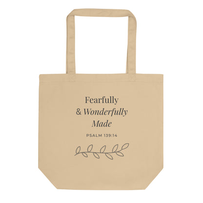 Front view of a natural cotton Christian tote bag with matching beige handles and “Fearfully & Wonderfully Made Psalm 139:14” text.