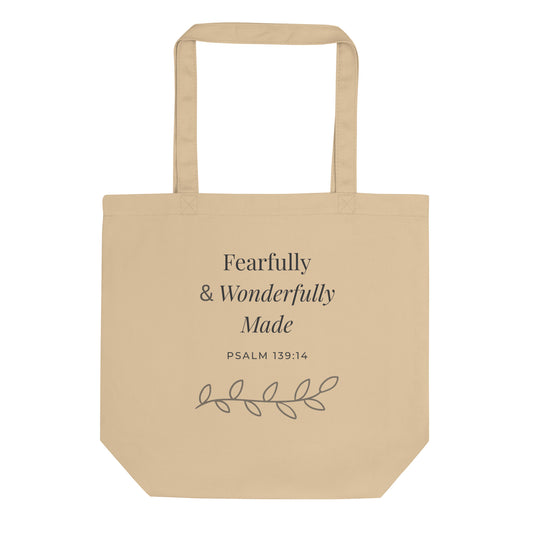 Front view of a natural cotton Christian tote bag with matching beige handles and “Fearfully & Wonderfully Made Psalm 139:14” text.