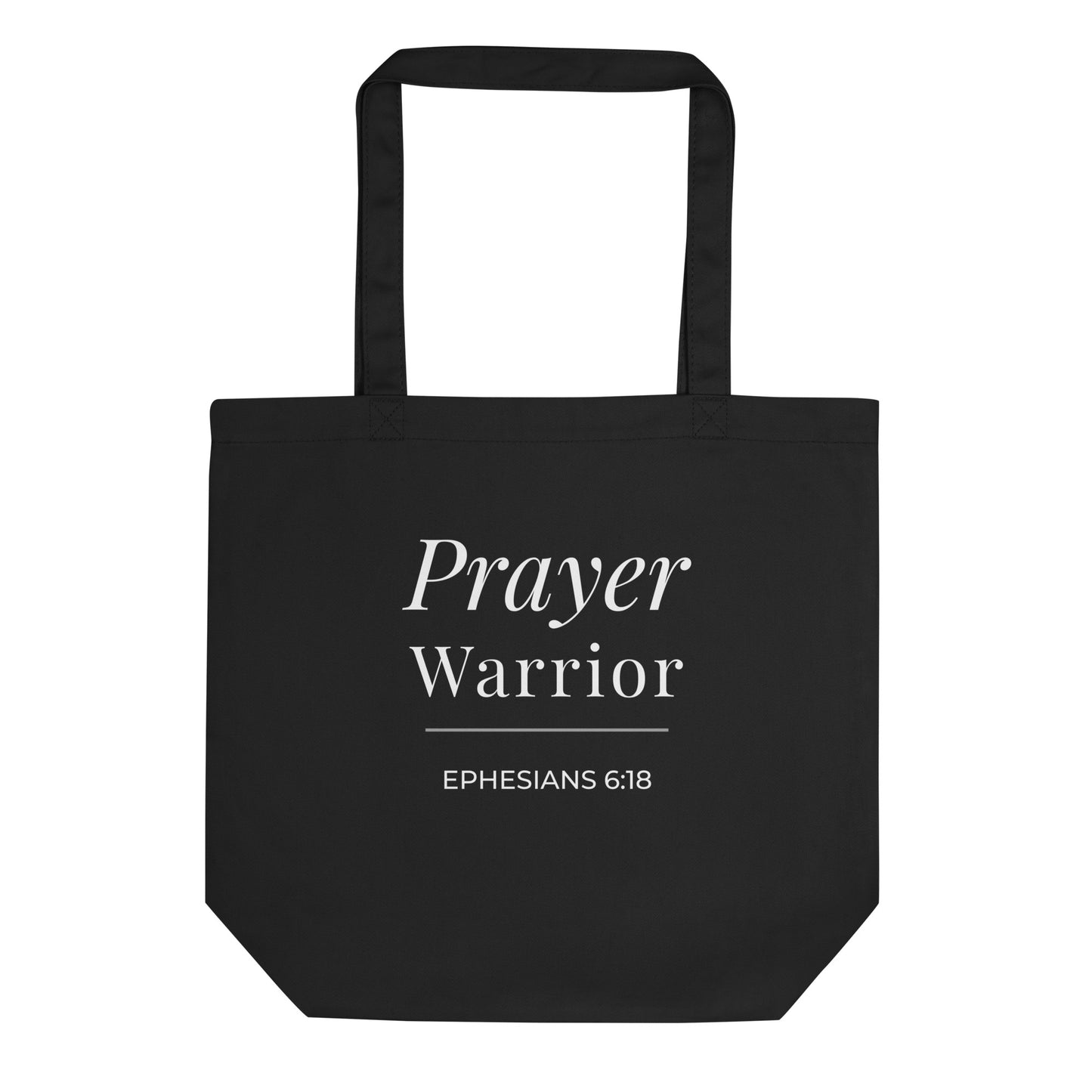 Front view of a black cotton Christian tote bag with white “Prayer Warrior” lettering, Ephesians 6:18, and a simple underline accent.
