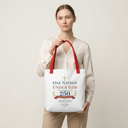 Model carrying a patriotic Christian tote bag with red handles and a faith-based 250 years of freedom design.
