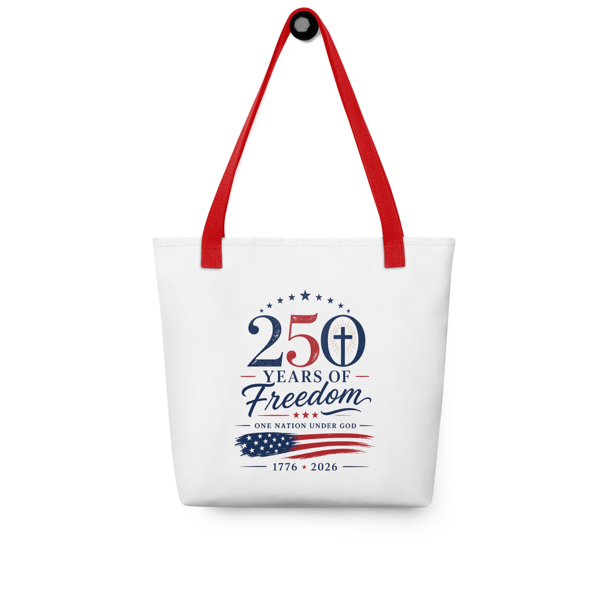 Christian patriotic tote bag hanging on a hook, featuring red straps, stars, a cross, and “250 Years of Freedom” artwork.