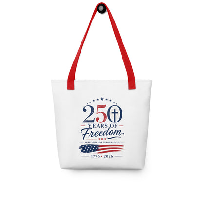 Christian patriotic tote bag hanging on a hook, featuring red straps, stars, a cross, and “250 Years of Freedom” artwork.