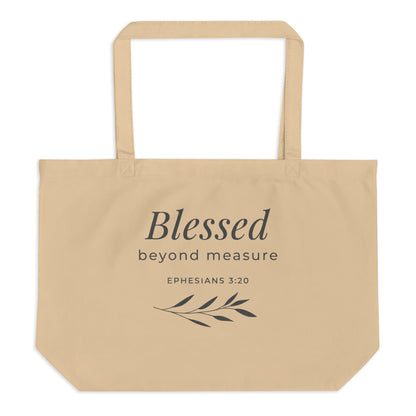Front view of a natural cotton Christian tote bag with matching beige handles and a “Blessed Beyond Measure Ephesians 3:20” design.