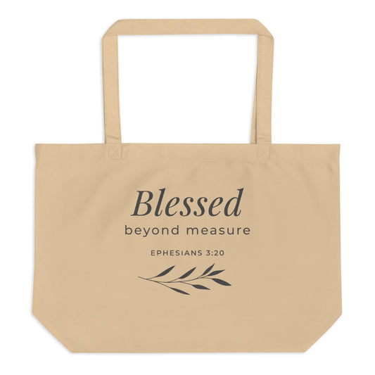 Front view of a natural cotton Christian tote bag with matching beige handles and a “Blessed Beyond Measure Ephesians 3:20” design.