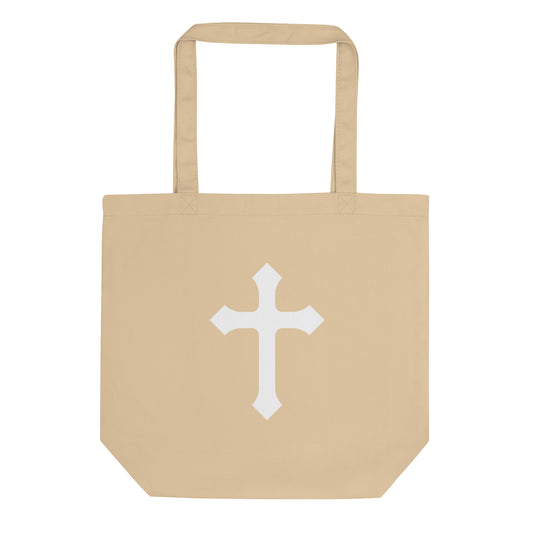 Natural cotton tote bag with a large white cross graphic centered on the front.