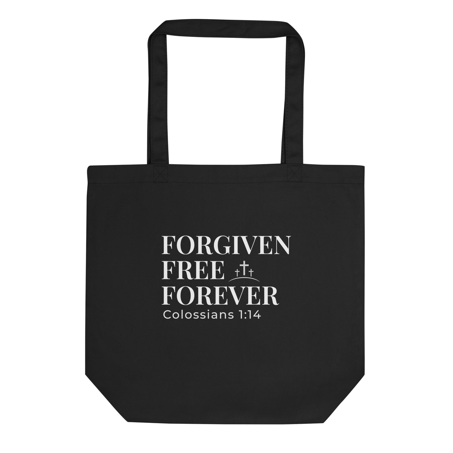 Front view of a black tote bag with white text reading “Forgiven Free Forever” and “Colossians 1:14” with a small cross design.