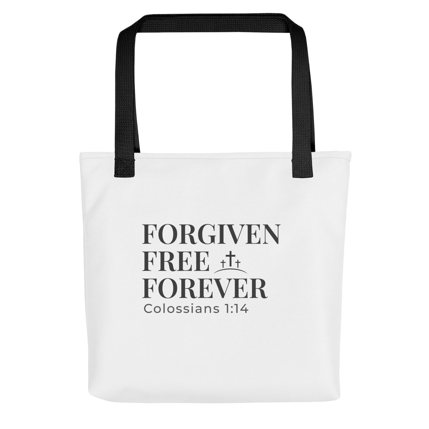 White tote bag with black handles featuring “FORGIVEN FREE FOREVER” and “Colossians 1:14” with a small cross icon.