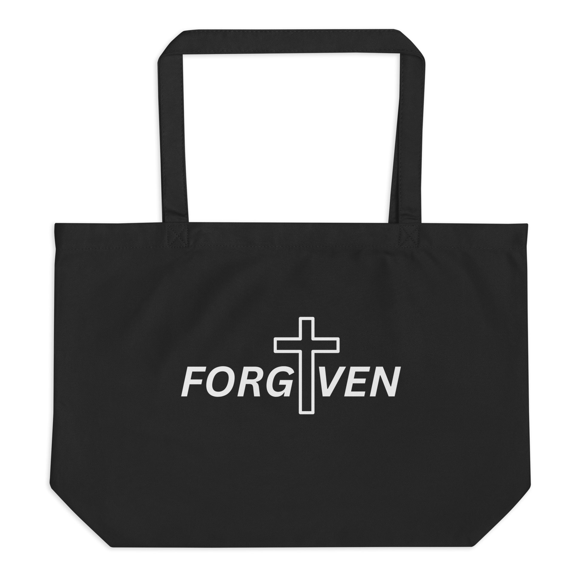 Large black cotton tote bag with a bold “FORGIVEN” design and a white cross graphic centered through the word.