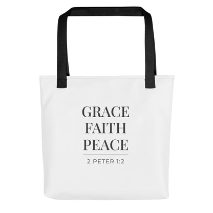 White tote bag with black handles featuring “Grace Faith Peace” and “2 Peter 1:2” in dark gray text.
