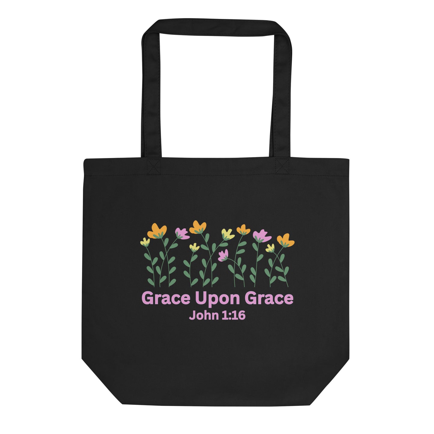 Black cotton tote bag with a colorful floral graphic above “Grace Upon Grace” and “John 1:16” in pink text.