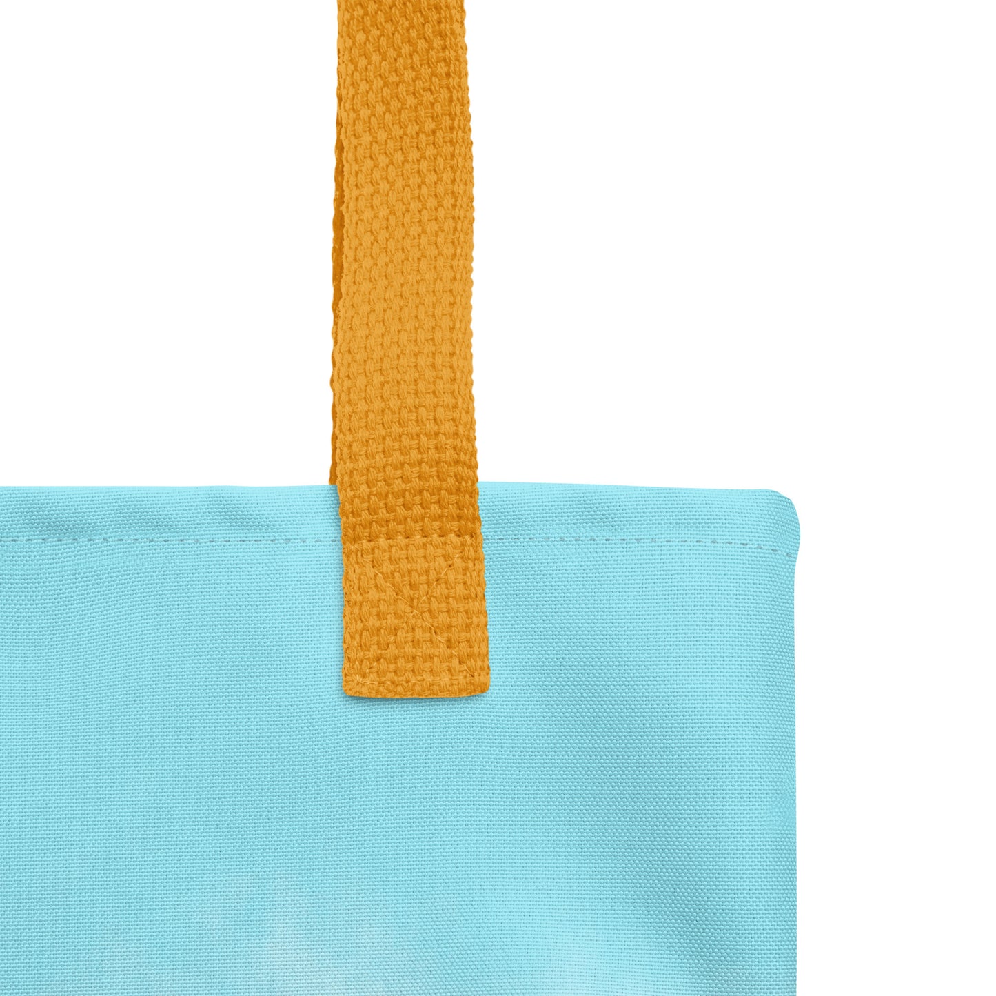 Close-up of a Christina tote bag with a mustard yellow strap on a white background