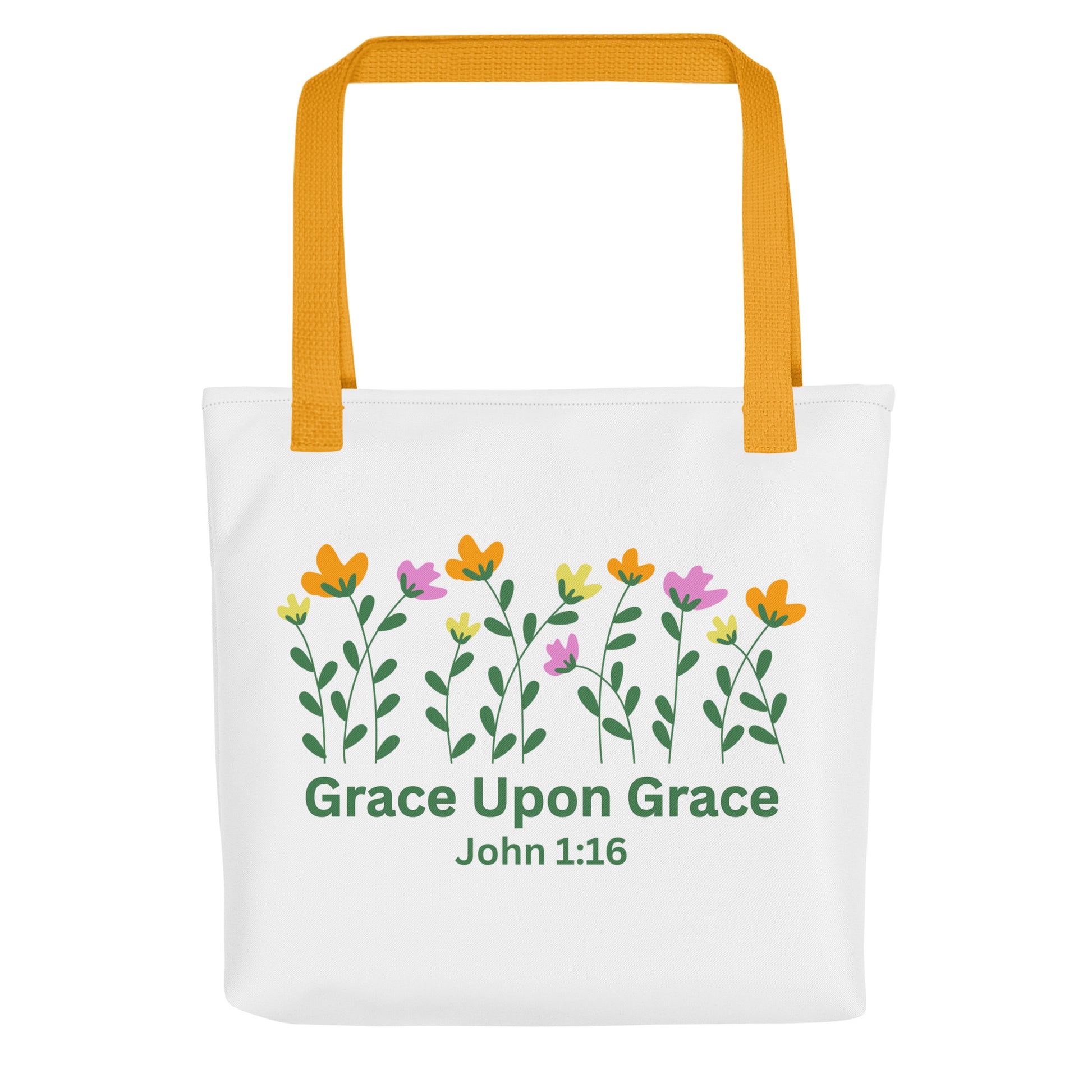 Front view of a white ‘Grace Upon Grace’ John 1:16 tote bag with mustard-yellow straps and floral graphic above green text.