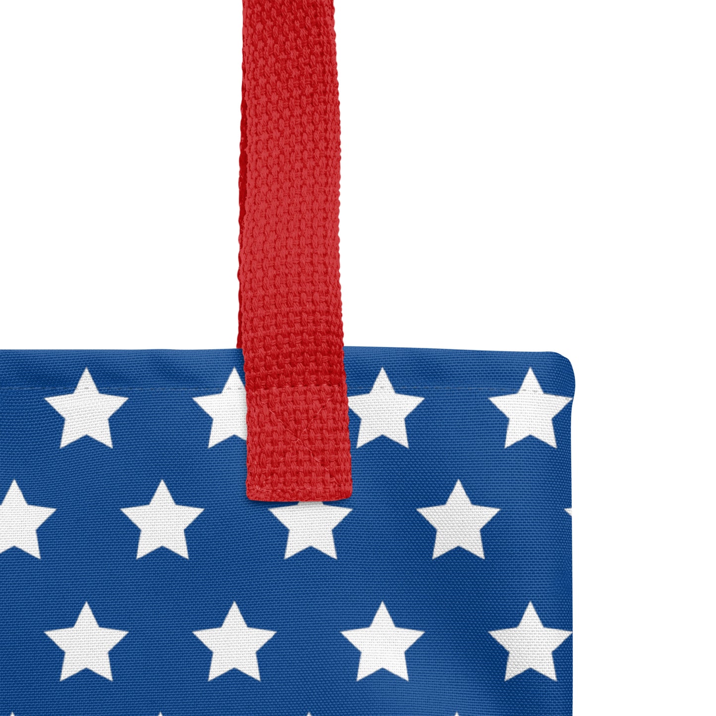 Close-up of a patriotic Christian tote bag design with blue stars, red and white stripes, and bold red “Jesus” text.