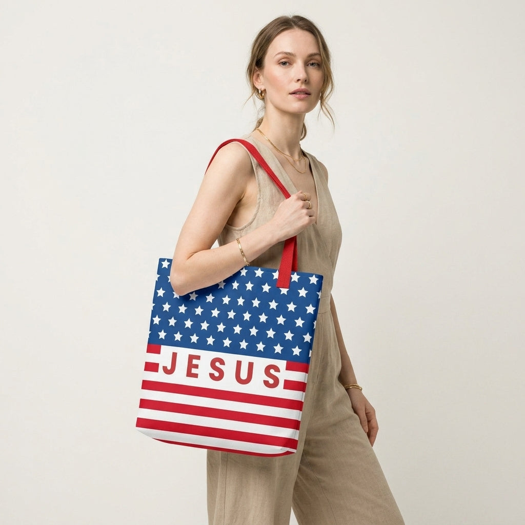 Model carrying a patriotic Christian tote bag with red handles, an American flag-inspired design, and “Jesus” text across the front.