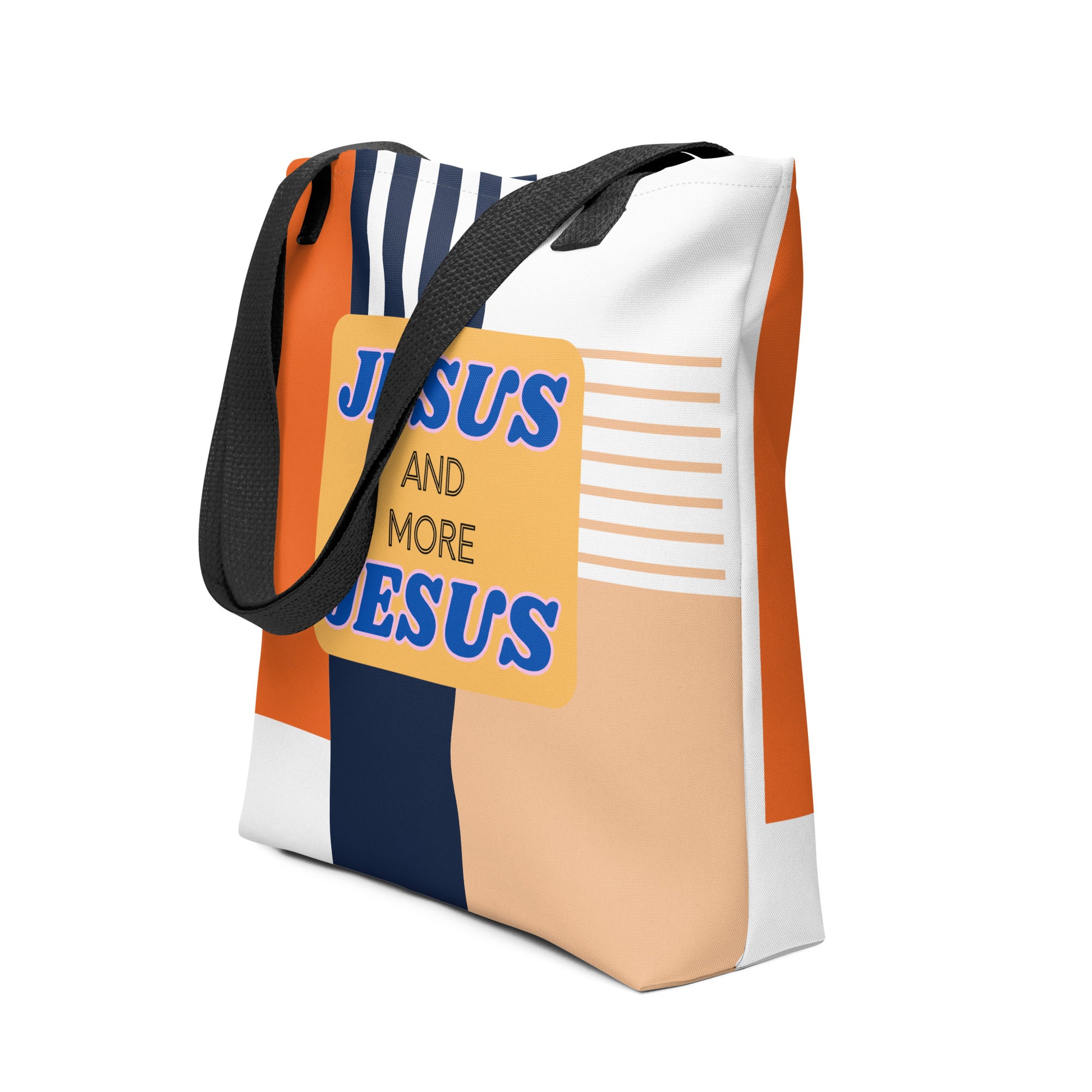 Angled view of the “Jesus and More Jesus” tote bag showing black straps and retro-inspired color blocks with striped accents.