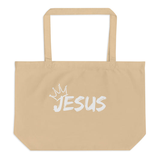 Large natural cotton tote bag with a white brush-style “JESUS” graphic and a small crown above the lettering.