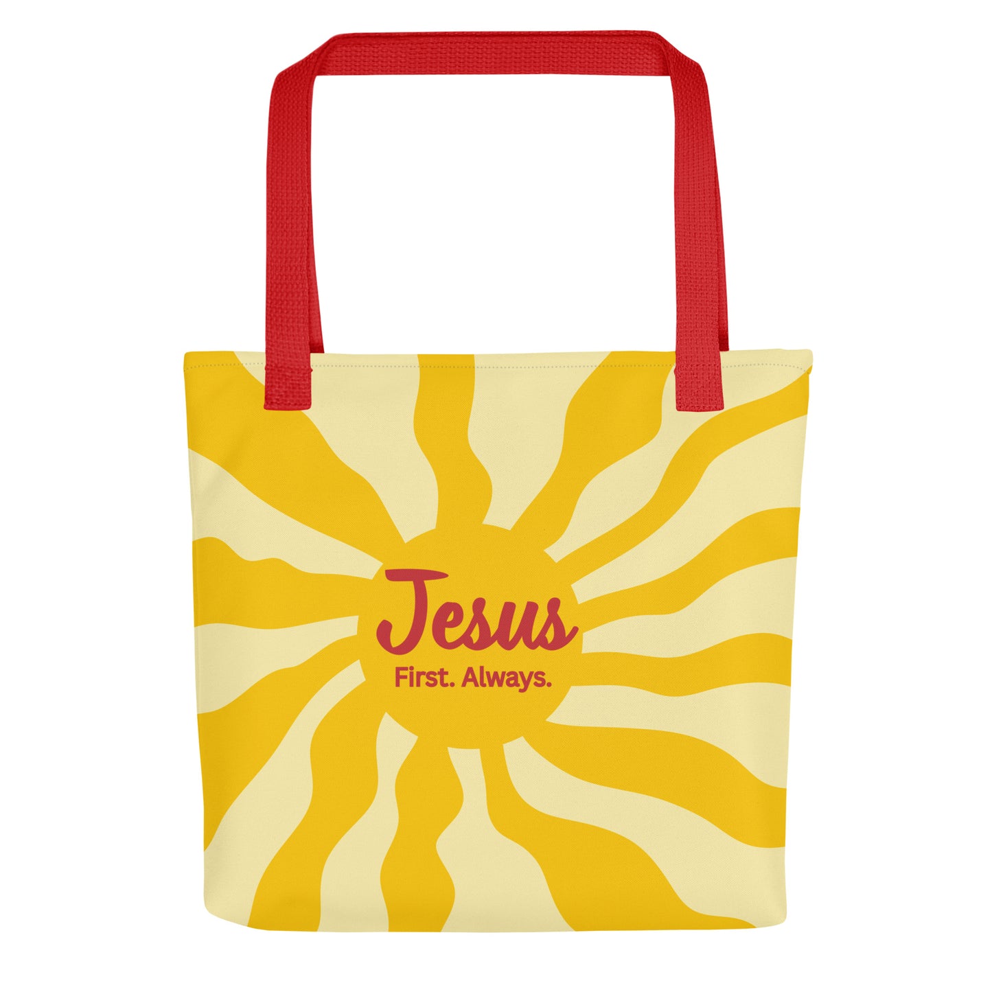 Front view of tote bag with red straps and yellow sunburst design, featuring the words “Jesus First. Always.”
