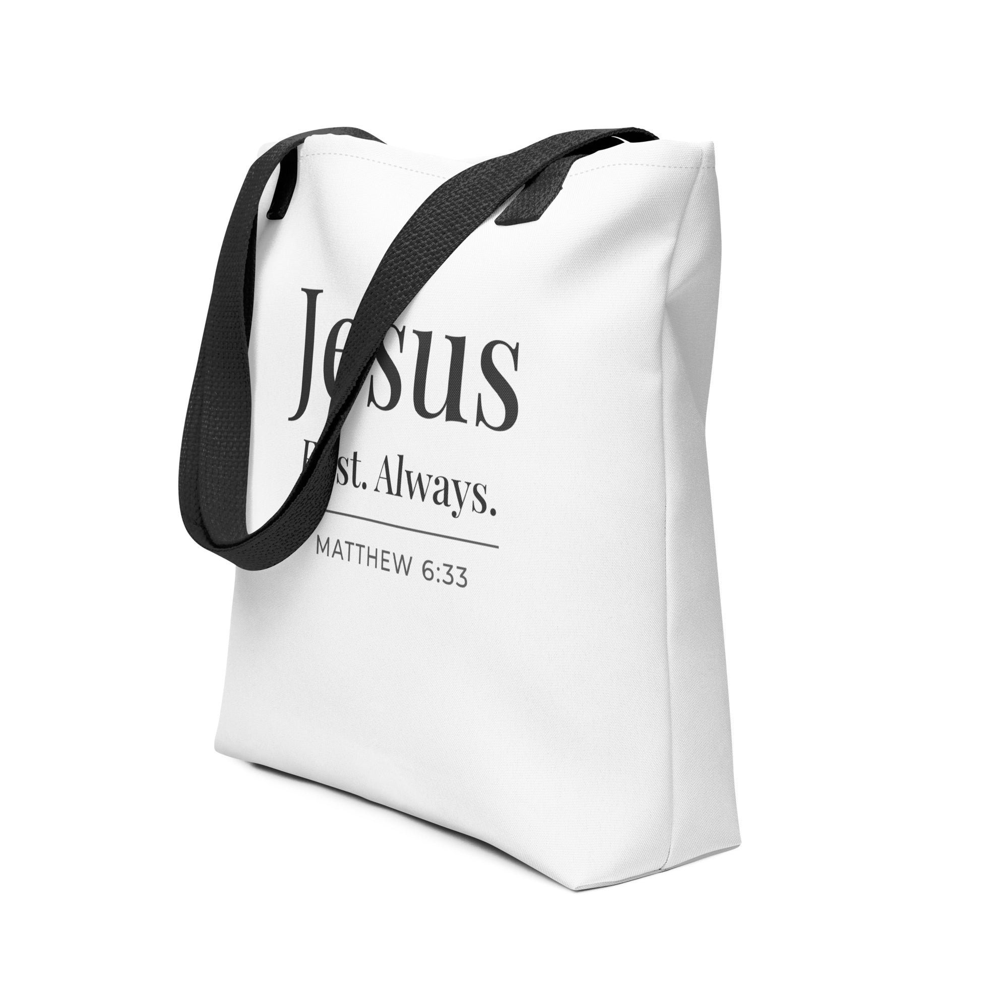 White Christian tote shown at an angle with “Jesus First. Always.” in dark gray lettering and the scripture reference “Matthew 6:33.”